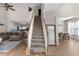 Spacious living area features staircase, and a view into the dining area at 3321 Spindletop Nw Dr, Kennesaw, GA 30144