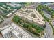 Scenic aerial view of the apartment complex including water feature, roads and surrounding businesses at 390 17Th Nw St # 4057, Atlanta, GA 30363