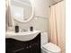 Practical bathroom with shower, sink, and mirror at 2533 Semmes St, East Point, GA 30344