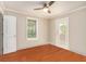 Empty bedroom with hardwood floors, ceiling fan, and ample natural light at 2533 Semmes St, East Point, GA 30344