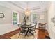 Charming dining room boasts hardwood floors and natural lighting at 2533 Semmes St, East Point, GA 30344