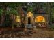 Charming brick home with an arched doorway and lush landscaping in the front yard at 2533 Semmes St, East Point, GA 30344