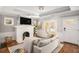 Inviting living room features a white brick fireplace and hardwood floors at 2533 Semmes St, East Point, GA 30344