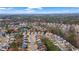 Aerial view of a residential area with manicured lawns, mature trees, and sidewalks for strolls at 1050 Westwell Run, Alpharetta, GA 30022