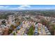 Expansive aerial view of a suburban neighborhood featuring mature trees and well-maintained homes at 1050 Westwell Run, Alpharetta, GA 30022
