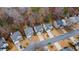 Aerial view showcases a charming neighborhood with well-maintained homes and tree-lined streets at 1050 Westwell Run, Alpharetta, GA 30022