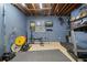 Spacious basement workout area features exercise equipment and open ceiling at 1050 Westwell Run, Alpharetta, GA 30022