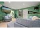 Basement living room with large TV, comfortable seating, and carpet flooring at 1050 Westwell Run, Alpharetta, GA 30022