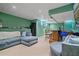 Basement living room with a bar area, comfortable seating, and modern design at 1050 Westwell Run, Alpharetta, GA 30022