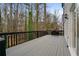 Spacious outdoor deck perfect for entertaining, with black railings and room for grilling at 1050 Westwell Run, Alpharetta, GA 30022