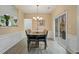 Cozy dining room with hardwood floors, wainscoting, and sliding glass doors to the backyard deck at 1050 Westwell Run, Alpharetta, GA 30022