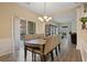 Comfortable dining room with hardwood floors, access to the deck, and open to the living area at 1050 Westwell Run, Alpharetta, GA 30022