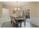 Dining room with hardwood floors, neutral walls, and sliding doors leading to the outdoor deck at 1050 Westwell Run, Alpharetta, GA 30022