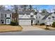 Inviting two-story house with a double garage and a neatly kept front lawn at 1050 Westwell Run, Alpharetta, GA 30022