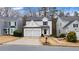 Charming two-story home with a two-car garage and well-maintained landscaping at 1050 Westwell Run, Alpharetta, GA 30022
