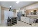 Sunlit eat-in kitchen with stainless steel appliances, granite countertops, and modern features at 1050 Westwell Run, Alpharetta, GA 30022