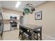 Eat-in kitchen with stainless steel appliances, granite countertops, and modern lighting at 1050 Westwell Run, Alpharetta, GA 30022