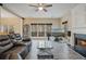 Open living room with fireplace, large windows, and modern furnishings at 1050 Westwell Run, Alpharetta, GA 30022