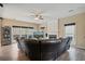 Comfortable living room featuring a fireplace, view to the backyard, and dark leather sofa at 1050 Westwell Run, Alpharetta, GA 30022