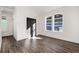 Bright bedroom featuring wood grain floors, natural light, and closet with double doors at 1088 Wedgewood Nw Dr, Atlanta, GA 30318