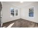 Bright bedroom with natural light from multiple windows and wood grain flooring at 1088 Wedgewood Nw Dr, Atlanta, GA 30318