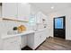 Modern kitchen featuring white cabinets, white countertops, and stainless steel sink at 1088 Wedgewood Nw Dr, Atlanta, GA 30318