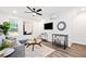Relaxing living room with a comfortable sofa, modern ceiling fan, and bright natural light at 1088 Wedgewood Nw Dr, Atlanta, GA 30318