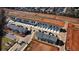 Newly built townhomes with garages, surrounded by developing community infrastructure and greenery at 11661 Mendenhall Ct, Hampton, GA 30228