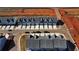 New townhomes with modern design, garages, and street parking in a developing neighborhood at 11661 Mendenhall Ct, Hampton, GA 30228