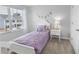 A bedroom is decorated with modern furniture, window and accents at 11661 Mendenhall Ct, Hampton, GA 30228