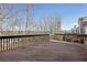 Expansive deck with dark railings, offering views of a tranquil, wooded neighborhood at 70 Wentworth Ln, Villa Rica, GA 30180