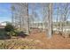 Expansive backyard featuring mature trees and lush foliage creating a serene, natural setting at 70 Wentworth Ln, Villa Rica, GA 30180