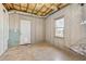Unfinished basement view featuring insulation, a door and a window at 70 Wentworth Ln, Villa Rica, GA 30180