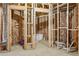 Unfinished basement revealing framing, insulation, and plumbing for a future bathroom at 70 Wentworth Ln, Villa Rica, GA 30180