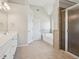 Spacious bathroom featuring a double vanity, tiled floors, walk in shower, and soaking tub at 70 Wentworth Ln, Villa Rica, GA 30180
