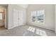 Bedroom with a window, closet, neutral walls, carpet, and lots of natural light at 70 Wentworth Ln, Villa Rica, GA 30180