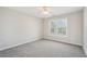 Cozy bedroom with a ceiling fan, large windows, and neutral-toned walls at 70 Wentworth Ln, Villa Rica, GA 30180