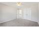 This bedroom features neutral walls, carpet, a ceiling fan and a closet at 70 Wentworth Ln, Villa Rica, GA 30180