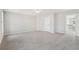 Bright and airy bonus room with plush carpet and a ceiling fan, offering flexible living space at 70 Wentworth Ln, Villa Rica, GA 30180