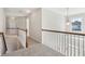Upstairs hallway showcasing a wooden and white banister at 70 Wentworth Ln, Villa Rica, GA 30180