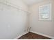 Laundry room with hardwood floors, utility connections and a window at 70 Wentworth Ln, Villa Rica, GA 30180