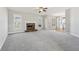 Spacious living room with a fireplace, plush carpeting, and large windows at 70 Wentworth Ln, Villa Rica, GA 30180