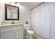 Bathroom vanity with a sink, toilet, and full bathtub shower combination at 942 Byron Sw Dr, Atlanta, GA 30310