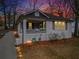 Charming home featuring a cozy front porch and a freshly painted exterior, complemented by manicured landscaping at 942 Byron Sw Dr, Atlanta, GA 30310