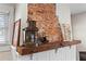 Close-up of fireplace with rustic mantle and decor at 942 Byron Sw Dr, Atlanta, GA 30310