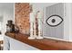 Close-up of brick fireplace with rustic mantle and decorative accents at 942 Byron Sw Dr, Atlanta, GA 30310
