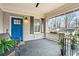 Charming front porch with seating, vibrant plants, and a view of the neighborhood's mature trees at 942 Byron Sw Dr, Atlanta, GA 30310