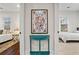 Hallway leads to bedrooms, showcasing colorful artwork and decor at 942 Byron Sw Dr, Atlanta, GA 30310