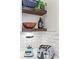 Bright kitchen details including rustic wood shelves, white subway tile backsplash, and counter appliances at 942 Byron Sw Dr, Atlanta, GA 30310