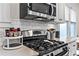 Modern kitchen with stainless steel appliances and subway tile backsplash at 942 Byron Sw Dr, Atlanta, GA 30310